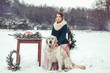 © Andreshkova Nastya - Portrait of nice girl with labrador playing outdoors in winter park