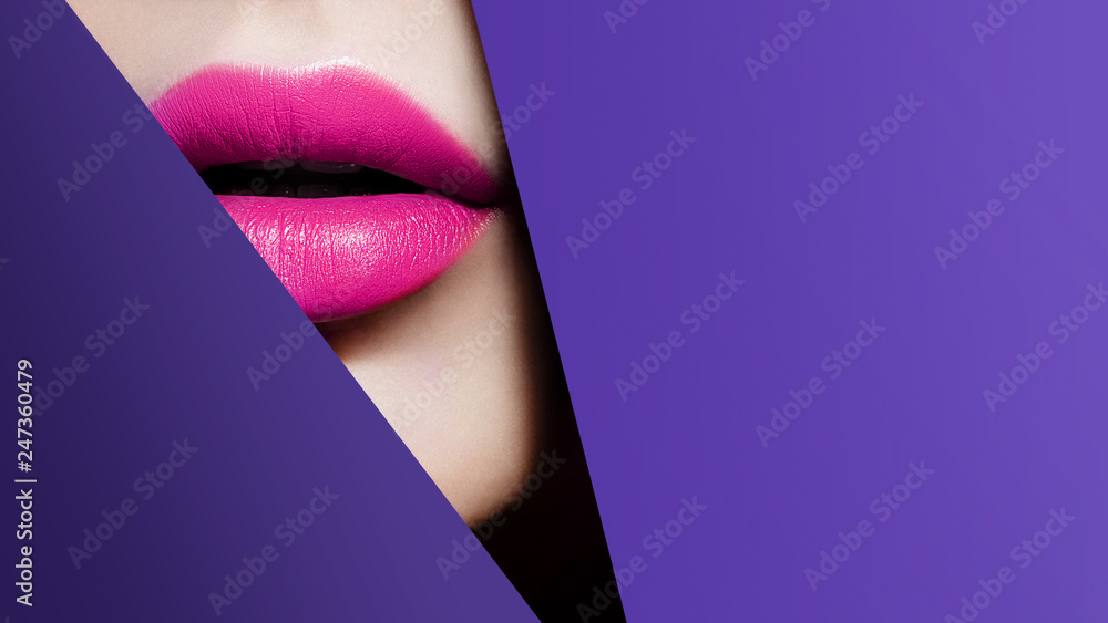 Plump bright pink lips in violet paper frame. Close up beauty photo. Geometry and minimalism. Creative fashion makeup - obrazy, fototapety, plakaty 