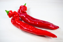 Red Pointed Chili On White Background,