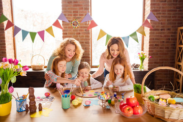 Poster - Portrait of nice attractive lovely sweet cheerful girls making decor cool stylish things carefully on table for event feast festive in house brick loft industrial interior room