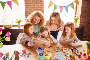 Poster - Portrait of nice cute attractive lovely sweet winsome cheerful girls making decor cool stylish things on table for event gift present in house brick loft industrial interior room