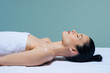 © LUMINA IMAGES - Beautiful Caucasian woman lying on massage table waiting for spa treatment.