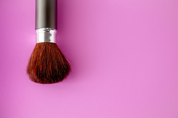 Makeup brush on Pink Pastel paper texture background. Pastel color , Minimal and Valentine concept. Copy space