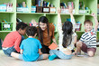 © mangpor2004 - Young asian woman teacher teaching kids in kindergarten classroom, preschool education concept