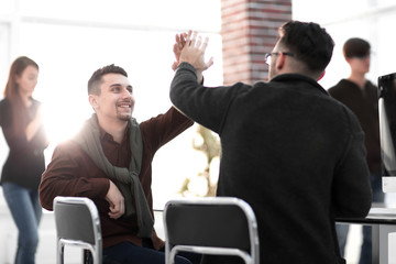 Canvas Print - business colleagues giving each other high five