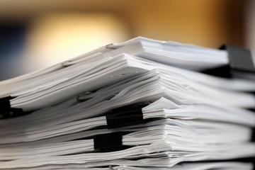 Pile of Papers with Binder Clips for Organizing