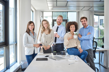 Group of multi ethnic business people posing in office. Start up business concept.