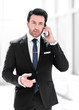 © ASDF - close up. businessman talking on smart phone.