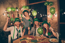 Close Up Photo Lucky Tradition Culture Celebrating Company Together St Paddy Day Mood Green Leprechaun Hats Glad Table Full Of Food Eat Tell Speak Talk Toasts Meet New Guests Decorated Flat Apartments