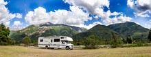 Motorhome In Chilean Argentine Mountain Andes. Family Trip Travel Vacation On Motorhome RV In Andes.