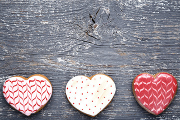 Wall Mural - Valentine day heart shaped cookies on grey wooden table