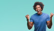 © Krakenimages.com - Afro american man over isolated background celebrating surprised and amazed for success with arms raised and open eyes. Winner concept.