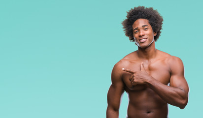 Wall Mural - afro american shirtless man showing nude body over isolated background cheerful with a smile of face