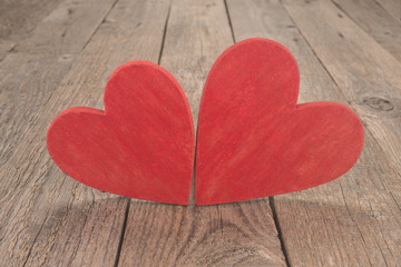 Wall Mural -    Two red hearts on wooden table 