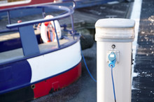Electric Charging Point For Boat And Barge At Marina Mooring On Canal