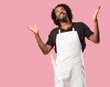 © Asier - Handsome african american baker laughing and having fun, being relaxed and cheerful, feels confident and successful