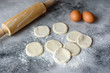 © chernikovatv - Preparation dough and production of circles from dough for preparation of dumplings with a stuffing. It can be used as a background