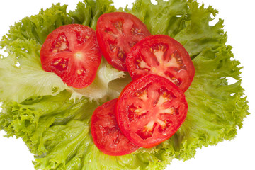 Wall Mural - tasty red tomatoes and lettuce on the table