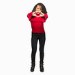 © Krakenimages.com - Young beautiful woman with curly hair smiling in love showing heart symbol and shape with hands. Romantic concept.
