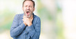 © Krakenimages.com - Handsome middle age elegant senior man over isolated background shouting and suffocate because painful strangle. Health problem. Asphyxiate and suicide concept.