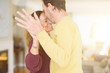 © Krakenimages.com - Romantic middle age couple dancing together in love at home