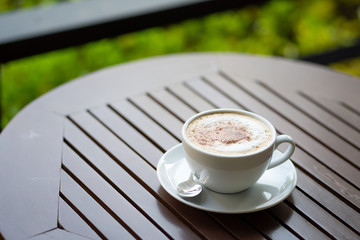 Wall Mural - Hot coffee mug placed on the table