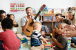 © Rawpixel.com - Nursery children playing with musical instruments in the classroom