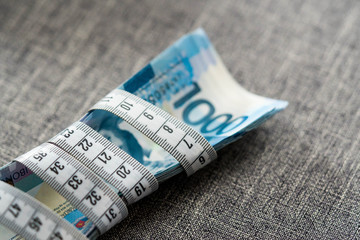 measuring tape on Philippine currency