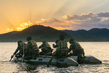 Special Forces Men In Camouflage Uniforms Paddling Army Kayak. Boat Moving Across The River In The Morning, Diversionary Mission,copy Space. - Image