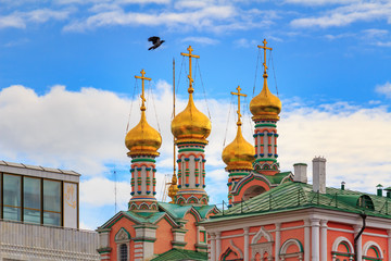 Wall Mural - Golden domes of Dormition Cathedral on the territory of Moscow Kremlin on a background of blue sky with clouds