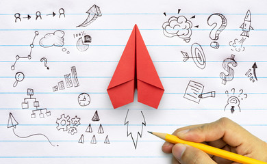 Wall Mural - Business success, innovation and solution concept, Red paper plane and business strategy with hand drawing on notebook