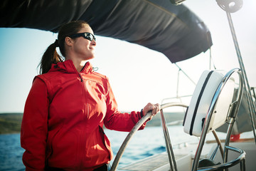 Canvas Print - Attractive strong woman sailing with her boat