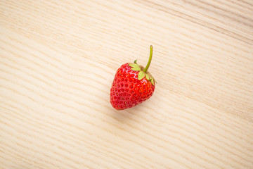 Fresh organic red ripe Strawberry fruit on wood background