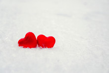 Two Beautiful Romantic Vintage Red Hearts Together On A White Snow Background. Love And St. Valentines Day Concept.