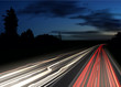 © Zonda - Vector image of colorful light trails with motion blur effect, long time exposure isolated on background