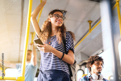 Beautiful Mixed Race Girl With Long Curly Hair Using Smart Phone