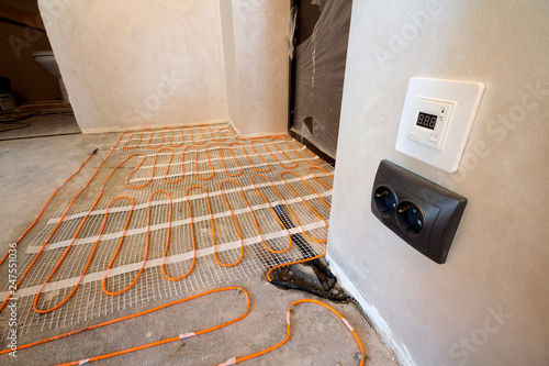 Heating Red Electrical Cable Wire System Installed On Cement Floor