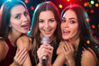 © chagin - Girls having fun singing at a party