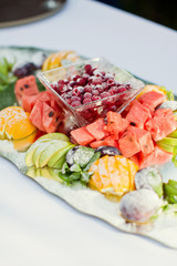 fresh fruits on glass plate