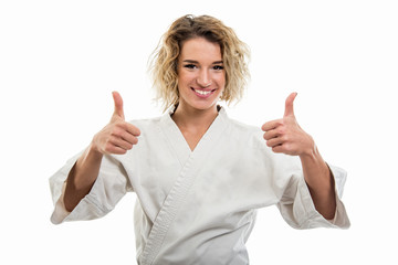 Portrait of female wearing martial arts uniform showing double like gesture