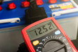 © Love the wind - Checking voltage battery of ca with volt meter 12 v. dc