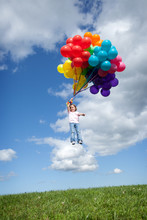 Little Girl Floating Away With Bunch Of Balloons