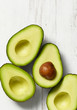 © Ralph Smith - Four Avocados on a white rustic background