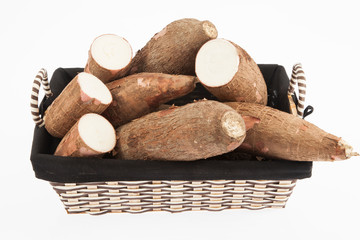 Raw yucca on white background-Manihot esculenta. (Cassava raw tuber)