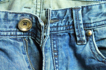 Denim. Old blue jeans. Front view. Close-up. Background. Texture.