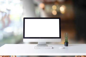Mockup computer on office desk and cactus in office.