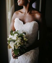 Charming African American Bride Smiles Standing Before The Window