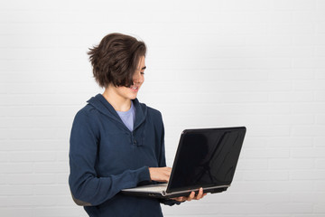 Wall Mural - student with laptop on white background