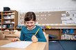 © Lucy Schaeffer - Girl smiling while taking test