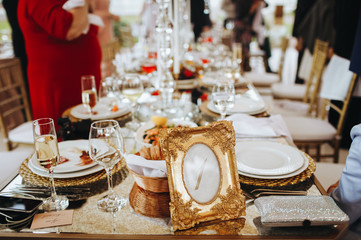 Frame with number one stands on the wedding dinner table